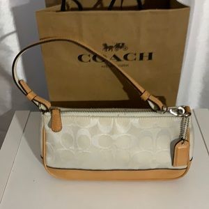 Coach beige can tan leather wristlet